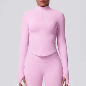 Detail view of pink yoga jacket sleeve with practical thumb holes for sports stability