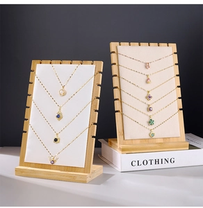 Detail of wooden necklace display stand with card slots and stable wide base