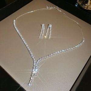 Detailed view of silver zircon jewelry set with Y-shaped necklace and long tassel earrings