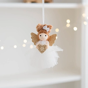 Detail of handmade Christmas angel doll with tulle skirt and golden glitter heart