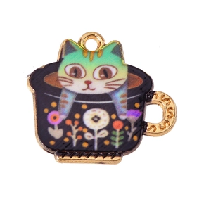 Macro view of cartoon cat in a floral teacup pendant with colorful enamel finish