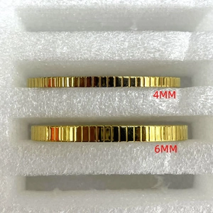 Detailed view of 4mm and 6mm gold stainless steel bracelets with vertical striped pattern