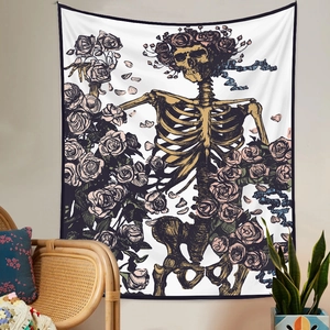 Close-up of illustration tapestry featuring skull and roses in home decor setting