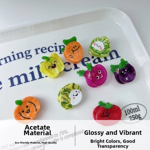 Detail view of colorful acetate hair clips featuring various cute vegetable designs