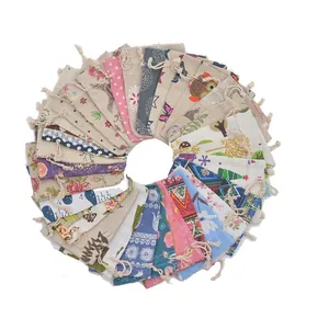 Various patterned cotton drawstring gift pouches with floral and geometric designs