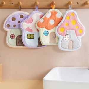 Absorbent mushroom shaped coral fleece hand towels in four colors hanging in a bathroom