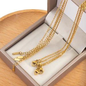 Detail of gold-plated stainless steel necklace chain with lobster clasp on velvet