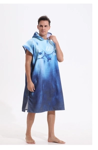 Detail of adult hooded microfiber beach poncho with blue tie-dye manta ray print