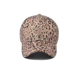 Suede baseball cap with gold foil leopard print and classic six-panel design on white background