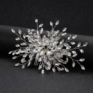 Exquisite bridal hair comb with marquise crystals and silver wire on black background