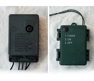 Detail of LED light controller with 8 modes and battery box on white snow background