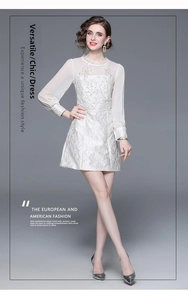 Detailed macro shot of white floral jacquard texture and elegant sheer chiffon sleeves