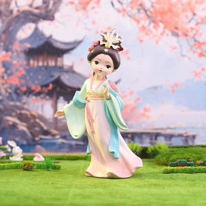 Close-up of a cute Q-style Four Beauties figurine in Hanfu against a garden background
