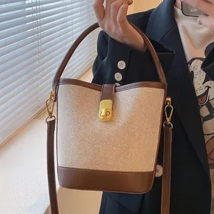 Women Vintage Canvas And PU Leather Bucket Bag Color Block Single Handle Gold Lock Niche Casual Shoulder Bag