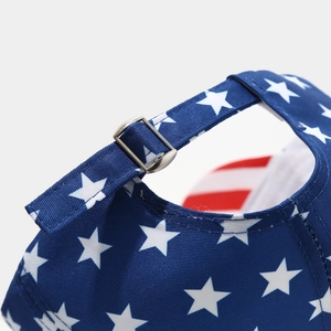 Close-up of adjustable metal buckle and American flag print on the baseball cap