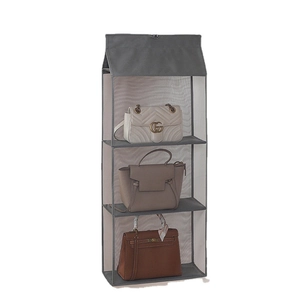 Grey 3-tier hanging handbag organizer for closet storage with clear mesh pockets