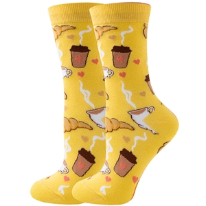 Close-up of yellow mid-calf cotton socks with coffee and croissant pattern designs