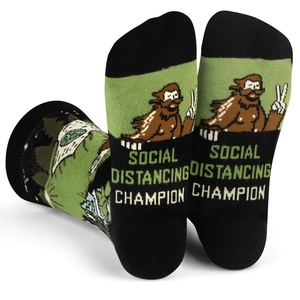 Close-up of cotton socks with Bigfoot and Social Distancing Champion text pattern