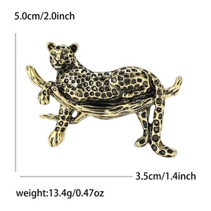 Golden and black enamel panther hugging a tree branch brooch with product dimensions