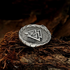 Nordic Viking Valknut pendant necklace in stainless steel on dark wood background