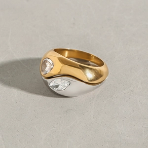 Close-up of dual-tone stainless steel layered ring with marquise-cut white stones