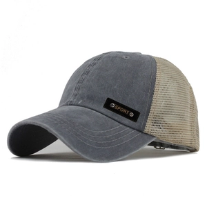 Detail of grey washed cotton baseball cap with khaki mesh back and sport badge