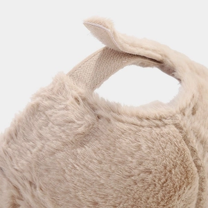 Detail of plush baseball cap featuring faux fur texture and adjustable velcro strap