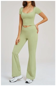 Detail of light green yoga set with crossover waist and functional side pockets