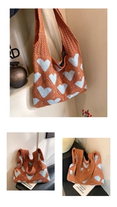 Close-up of knit tote bag with heart pattern and textured cable knit handles