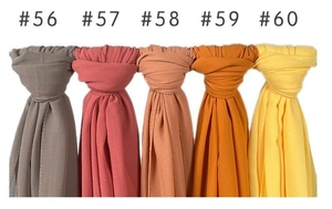 Detail display of solid pearl chiffon scarves in various colors numbered 56 to 60