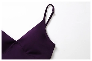 Detail of deep purple yoga bra featuring adjustable straps and a sleek V-neckline cut