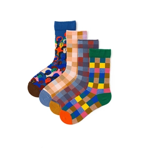 Flat lay of colorful cotton blend crew socks with pattern and plaid designs