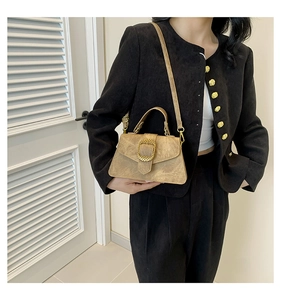 Chic beige crossbody bag with gold metal buckle and suede texture on model