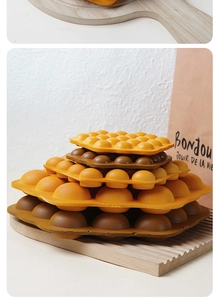 Detail of hexagonal PU bubble waffle models in yellow and brown colors for food display