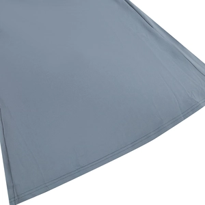 Detailed close-up showing fabric texture and double-stitched hem of the grey dress