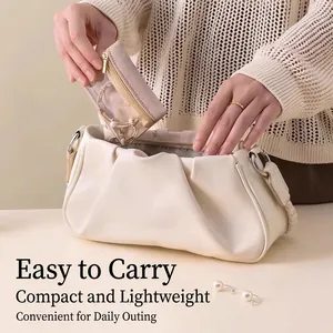 Elegant beige cloud-shaped PU leather jewelry storage bag with pink zippered inner pouch