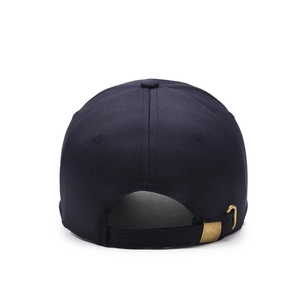Rear view of classic navy blue cotton baseball cap with adjustable bronze metal buckle