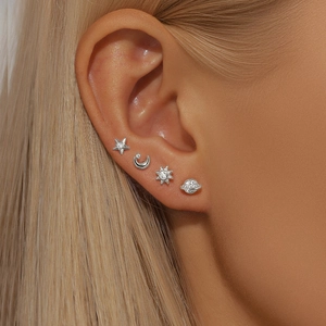 Detailed view of S925 silver stud earrings with celestial star and moon zircon designs