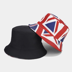Detail showing the Union Jack print and solid black reversible cotton bucket hat texture