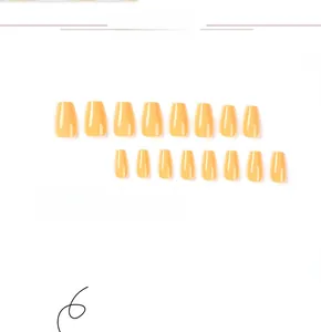 Macro shot of smooth light orange ballerina press-on nails in various sizes