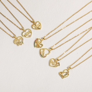 Detail showing 7 styles of 14K gold plated heart necklaces with MOM pendants and zircon