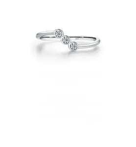 Close-up of three sparkling round cut moissanite stones set in a S925 silver ring