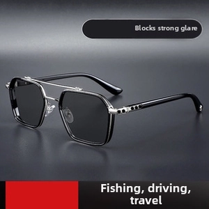 Detail view of octagon sunglasses with black frames and a stylish metal double bridge