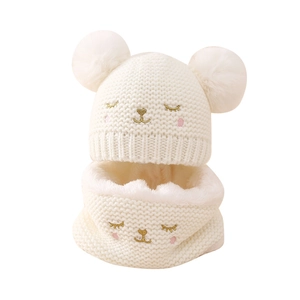 White knit baby hat and neck warmer set with faux fur poms and bear embroidery