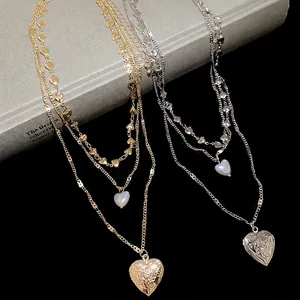 Three-layer heart pendant pearl necklace in gold and silver finish with locket