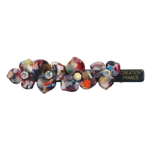 Macro shot of colorful acetate floral hair clip with shimmering rhinestones and black base