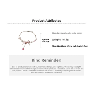 Detail showing dimensions of sweet beaded heart necklace with pink silk bow and resin beads