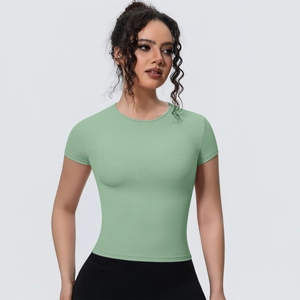 Close-up of slim-fit light green yoga t-shirt showing breathable fabric and stitching