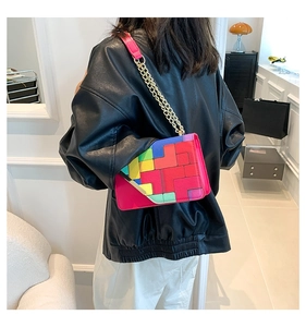 Colorful geometric color-block shoulder bag with gold chain strap on model