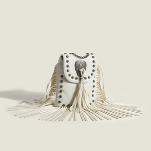 White rivet fringe crossbody bag with metallic skull and silver chain shoulder strap